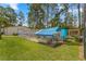 Chicken coop and run in the backyard at 3153 Sw Breezy Point Dr, Dunnellon, FL 34431