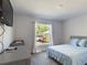 Bright bedroom with large window and comfy bed at 3962 Ne 58Th Cir, Silver Springs, FL 34488