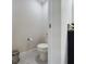 Clean bathroom with toilet, flooring, and vanity at 3962 Ne 58Th Cir, Silver Springs, FL 34488