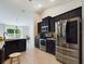 Modern kitchen featuring stainless steel appliances and dark cabinetry at 3962 Ne 58Th Cir, Silver Springs, FL 34488