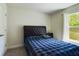 Bedroom with a bed, window and closet at 3962 Ne 58Th Cir, Silver Springs, FL 34488