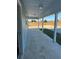 Covered back porch with concrete flooring at 73 Juniper Trail Loop, Ocala, FL 34480