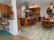 Well-equipped kitchen with wood cabinets, island, and breakfast nook at 56633 Otter Rd, Astor, FL 32102