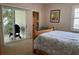 Bedroom with sliding glass doors leading to a private balcony at 56633 Otter Rd, Astor, FL 32102