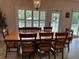 Dining room with large table and access to backyard at 56633 Otter Rd, Astor, FL 32102
