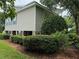 Elevated home with stone pillars and manicured lawn at 56633 Otter Rd, Astor, FL 32102