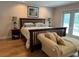 Main bedroom with king-size bed and access to balcony at 56633 Otter Rd, Astor, FL 32102
