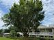 Two-story home nestled amongst lush landscaping at 56633 Otter Rd, Astor, FL 32102