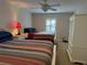 Guest bedroom with two beds and ceiling fan at 56633 Otter Rd, Astor, FL 32102