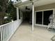 Spacious deck with ceiling fans, offering serene views at 56633 Otter Rd, Astor, FL 32102