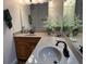 Bathroom with double sinks, wood cabinets, and a corner vanity at 56633 Otter Rd, Astor, FL 32102