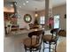 Kitchen breakfast bar with two barstools at 56633 Otter Rd, Astor, FL 32102