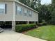 Elevated home with stone pillars and neat landscaping at 56633 Otter Rd, Astor, FL 32102