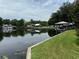 Calm riverfront view with lush lawn and gazebo at 56633 Otter Rd, Astor, FL 32102