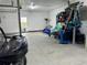 Large garage with shelving and additional storage at 56633 Otter Rd, Astor, FL 32102