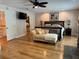 Bright main bedroom with hardwood floors, a walk-in closet and sitting area at 56633 Otter Rd, Astor, FL 32102