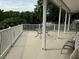Deck with table and chairs, overlooks a lush backyard at 56633 Otter Rd, Astor, FL 32102