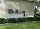 Three AC units neatly covered in a white lattice at 56633 Otter Rd, Astor, FL 32102