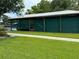 Covered boat storage with green canvas sides at 56633 Otter Rd, Astor, FL 32102