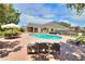 Large backyard oasis featuring a sparkling pool and patio furniture at 4818 Se 11Th Pl, Ocala, FL 34471