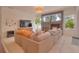 Gathering room with a sectional sofa, stone fireplace, and built-in entertainment center at 4818 Se 11Th Pl, Ocala, FL 34471