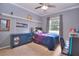 Bedroom with a double bed, dresser, and gaming setup at 4818 Se 11Th Pl, Ocala, FL 34471