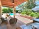 Relaxing patio with seating area overlooking the pool and backyard at 4818 Se 11Th Pl, Ocala, FL 34471