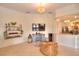 Gathering room with TV, comfortable seating, and view into kitchen at 4818 Se 11Th Pl, Ocala, FL 34471