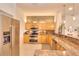 Modern kitchen with granite countertops, stainless steel appliances, and wood cabinets at 4818 Se 11Th Pl, Ocala, FL 34471