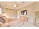 Main bedroom featuring a king bed, barn door, and built-in dresser at 4818 Se 11Th Pl, Ocala, FL 34471