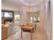 Bright dining area with a rustic wooden table and seating for four at 4818 Se 11Th Pl, Ocala, FL 34471