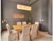 Elegant dining room featuring a wood table, six chairs, and a unique light fixture at 4818 Se 11Th Pl, Ocala, FL 34471