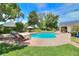 Inviting pool area with brick pavers, lounge chairs, and lush landscaping at 4818 Se 11Th Pl, Ocala, FL 34471