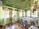 Unique bedroom with leafy ceiling, large windows and wood floors at 5401 Se 162Nd St # 32, Summerfield, FL 34491