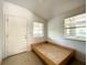 Bright bedroom featuring a platform bed and exterior access at 5401 Se 162Nd St # 32, Summerfield, FL 34491