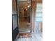 Cozy screened porch entryway with a view of the living room at 5401 Se 162Nd St # 32, Summerfield, FL 34491