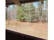 View of the backyard from the deck, showcasing trees and landscape at 5401 Se 162Nd St # 32, Summerfield, FL 34491