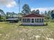 Charming one-story house with a red roof and white exterior at 5401 Se 162Nd St # 32, Summerfield, FL 34491