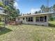 Ranch style home with a deck, satellite dish and large yard at 5401 Se 162Nd St # 32, Summerfield, FL 34491