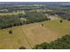 Aerial view of a rural property with a home and surrounding land at 5401 Se 162Nd St # 32, Summerfield, FL 34491