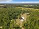 Aerial view of home on wooded lot with expansive pasture views at 5401 Se 162Nd St # 32, Summerfield, FL 34491