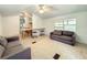 Cozy living room features a sofa and access to the kitchen at 5401 Se 162Nd St # 32, Summerfield, FL 34491