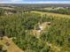 Aerial view of a rural property with a home and surrounding land at 5401 Se 162Nd St # 32, Summerfield, FL 34491