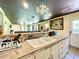 Kitchen with double sink, tile countertops and access to backyard at 5401 Se 162Nd St # 32, Summerfield, FL 34491
