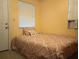 Cozy bedroom with double bed and window blinds at 5401 Se 162Nd St # 32, Summerfield, FL 34491