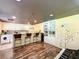 Kitchen features white cabinets, a breakfast bar and built-in shelving at 5401 Se 162Nd St # 32, Summerfield, FL 34491