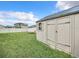 Landscaped backyard with storage shed and lawn at 8857 Sw 50Th Ter, Ocala, FL 34476