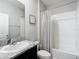 Clean bathroom with a shower/tub combo and granite vanity at 8857 Sw 50Th Ter, Ocala, FL 34476