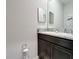 Bathroom with granite countertop and dark brown vanity at 8857 Sw 50Th Ter, Ocala, FL 34476