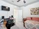 Bedroom with a twin daybed, a desk, and a TV at 8857 Sw 50Th Ter, Ocala, FL 34476